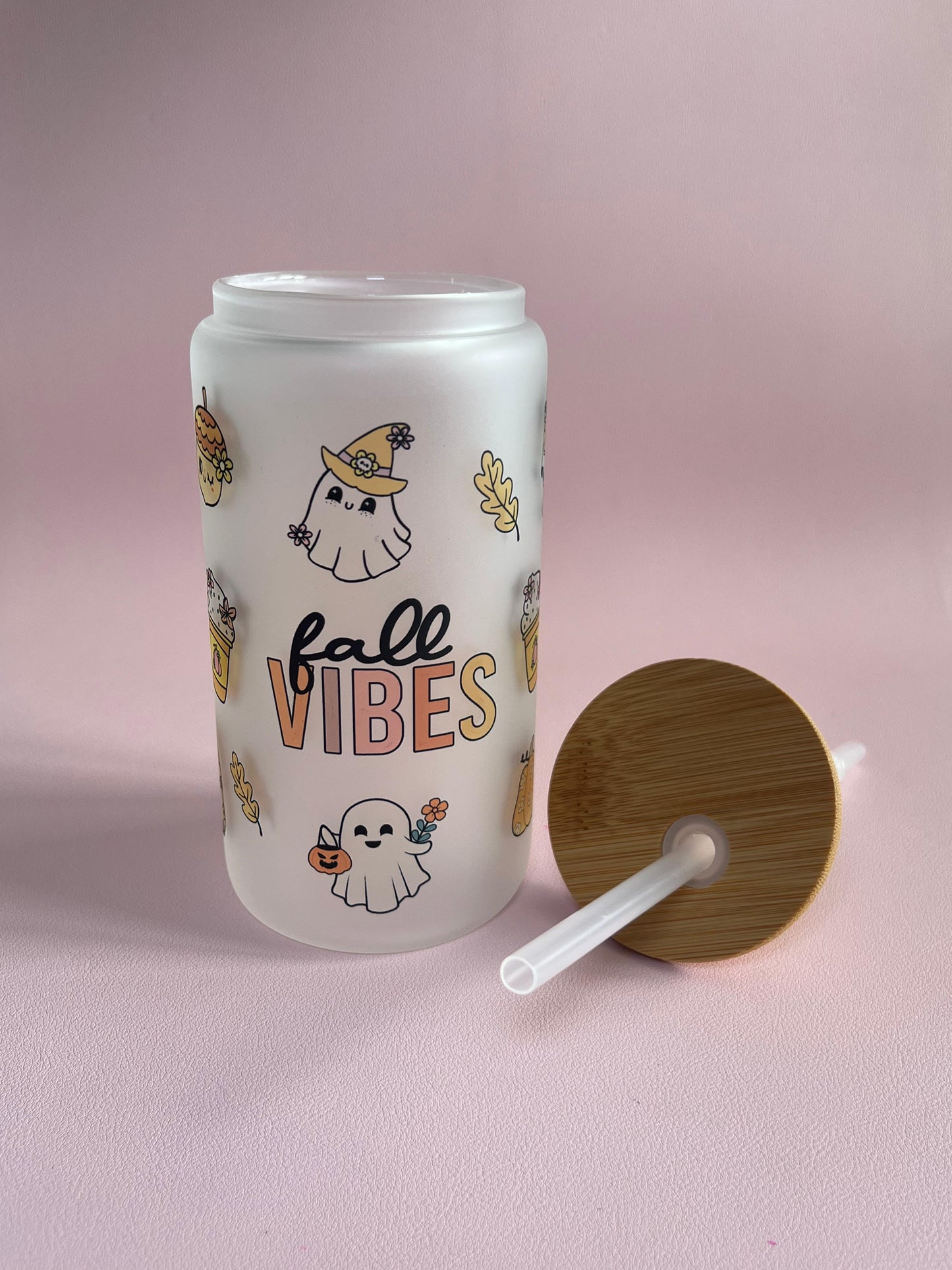 Tumbler with 'fall vibes' design, cute ghost, pumpkins on a pink background